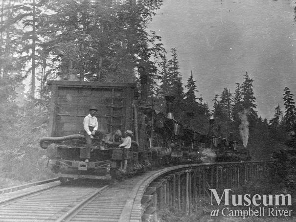 Steam donkey being moved by rail