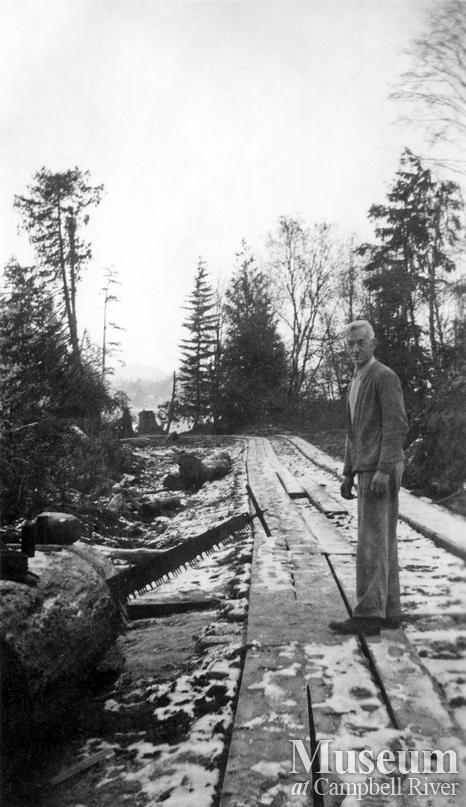 Doc Murray near a logging camp at Port Neville
