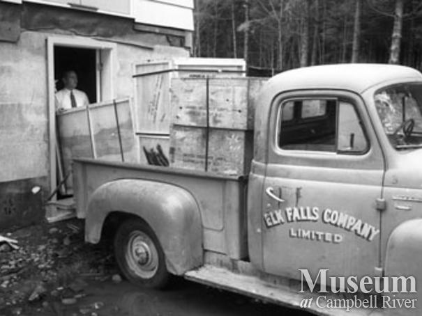 Elk Falls Co. truck being unloaded