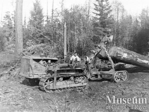 Elk River Timber Co. caterpillar skidding a log