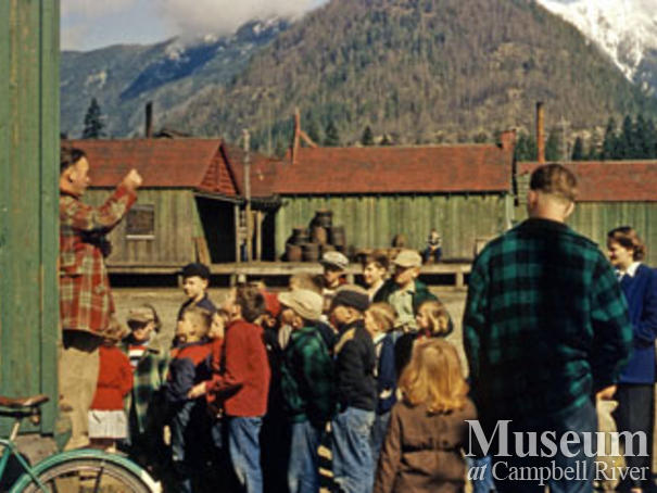 Kids at Woss post office, cookhouse in back